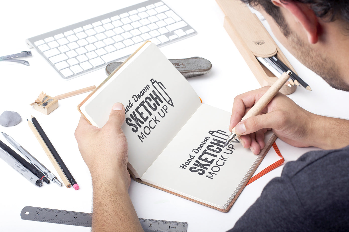 Download Free Hand Drawn Sketch Mockup with a Man Drawing ...