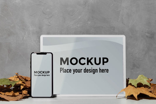 Free Mockup Devices Standing On The Table Next To Leaves Psd