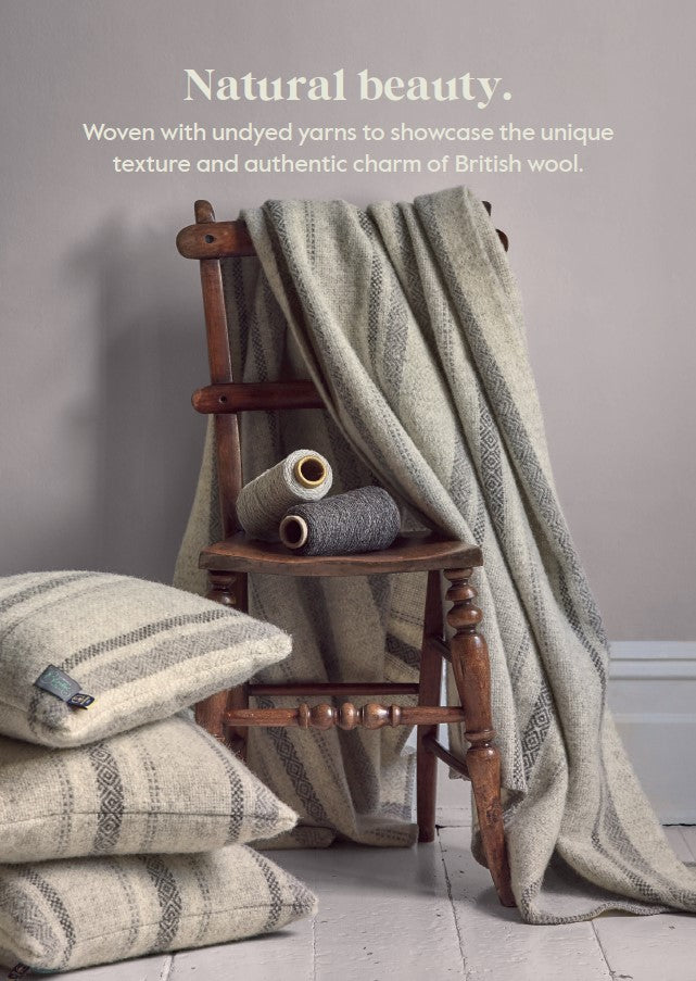 chair with 100 percent british wool throws cushions and blankets by The British Blanket Company