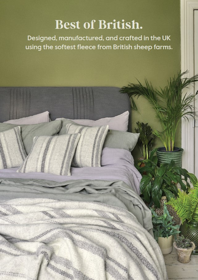 100 percent british wool throws blankets and cushions on a bed