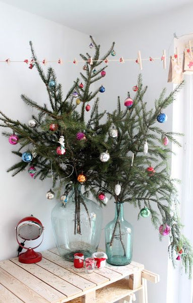 Christmas Tree Branches In a vase with hanging ornaments 