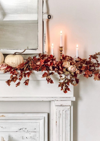 Autumn mantel with leaves and pumpkins