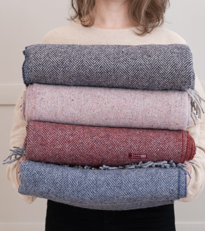 recycled wool and cashmere throw blankets from The British Blanket Company folded in a stack