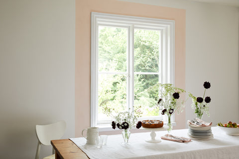 Here, delicate off-white walls painted in Earthborn’s Up Up Away are complemented by a strip of Peach Baby, perfectly highlighting a feature window