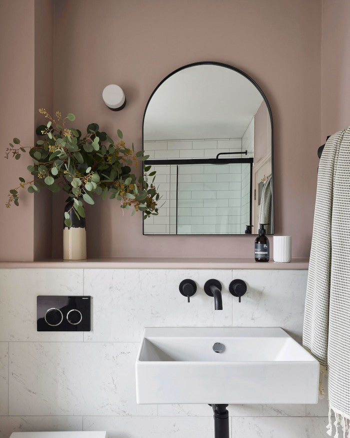 pink bathroom with white marble tiles