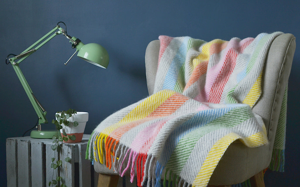 rainbow blanket throw on armchair