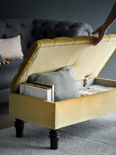 yellow ottoman with grey wool blanket throws from The British Blanket Co folded inside