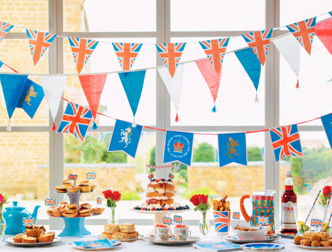 ideas and inspiration for a queens jubilee picnic party table with red white and blue bunting and British party food