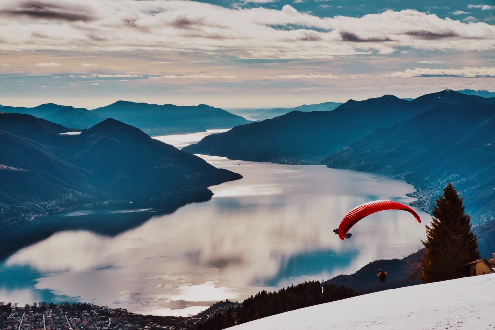 paraglider over lake and mountains - wedding gift ideas