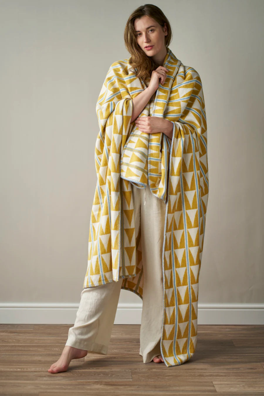 woman wrapped in a cloud cotton blanket from the British Blanket Company