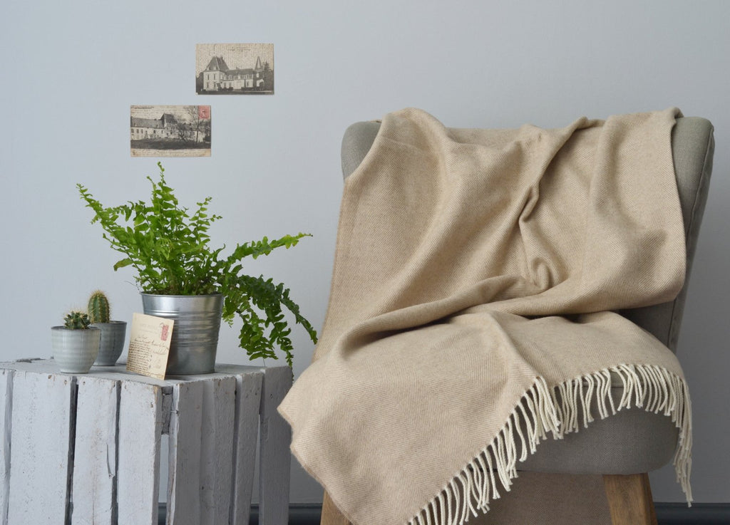 beige throw in coastal decor