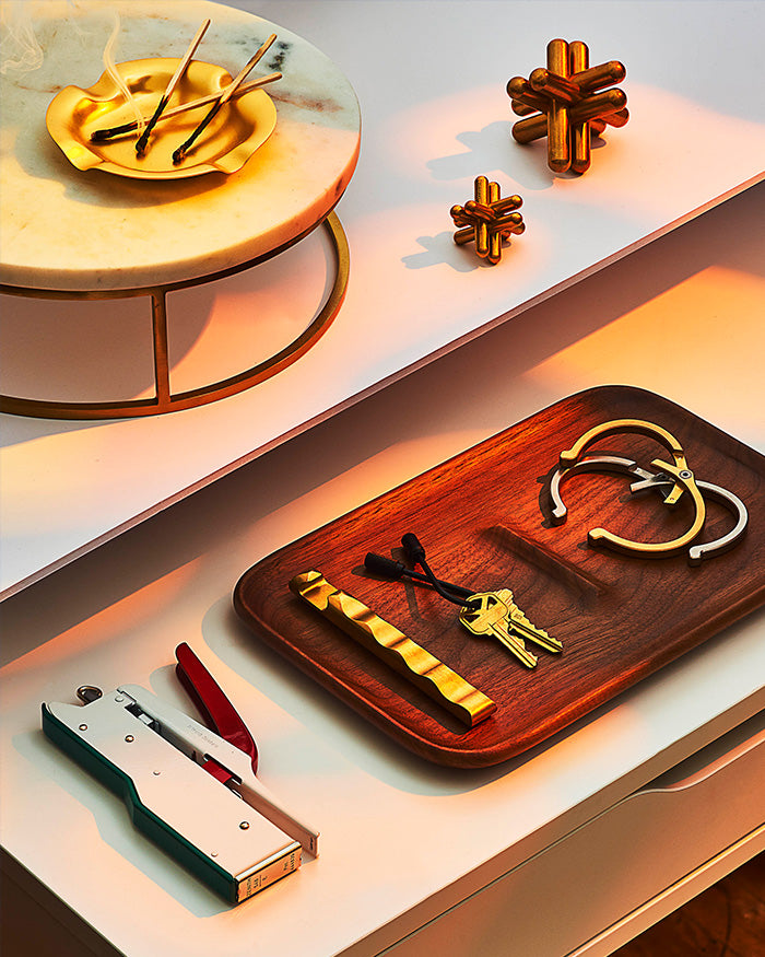 nocturn catch tray holding keyring, cuffs, and bottle opener craighill product design gifting