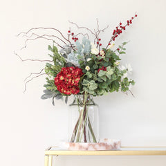 red artificial flower arrangement