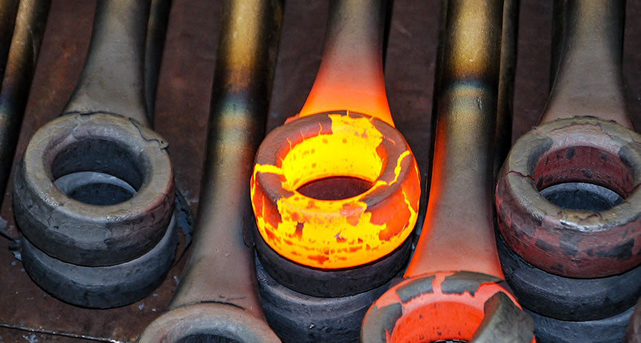 A stack of forged wrenches cooling off.