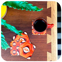 70s Op Art Coasters on vintage table with vintage mug and house plant - birdseye vew