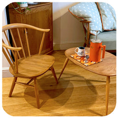 customer photo orange op art place mat on  Ercol coffee table, with Ercol chair