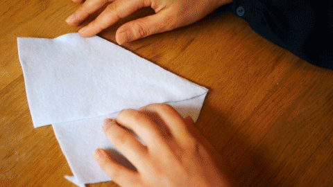 A GIF of two white felt piece being flipped open