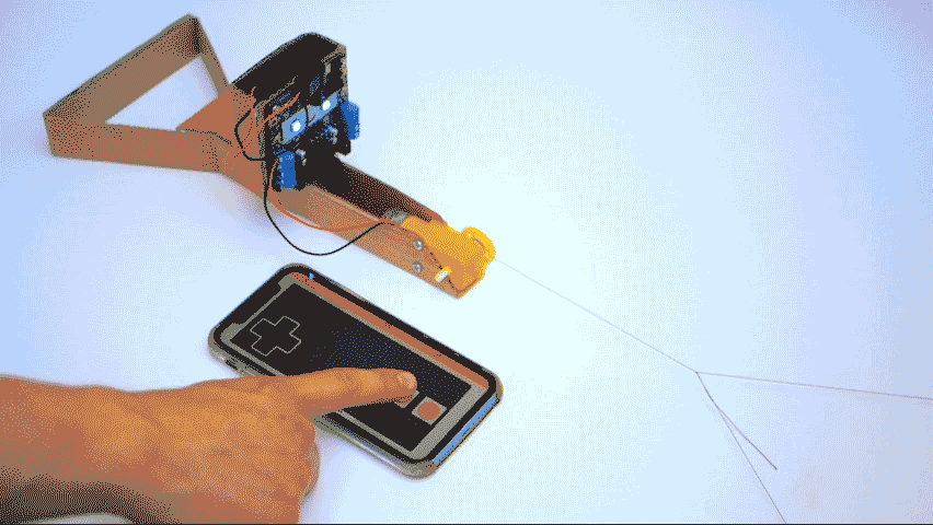 Image shows Smartibot app being used to drive the motor so it spools the string holding the cradle around the pulley.