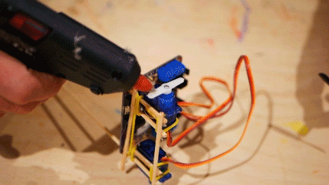 A GIF of propellor being attached to a blue servo