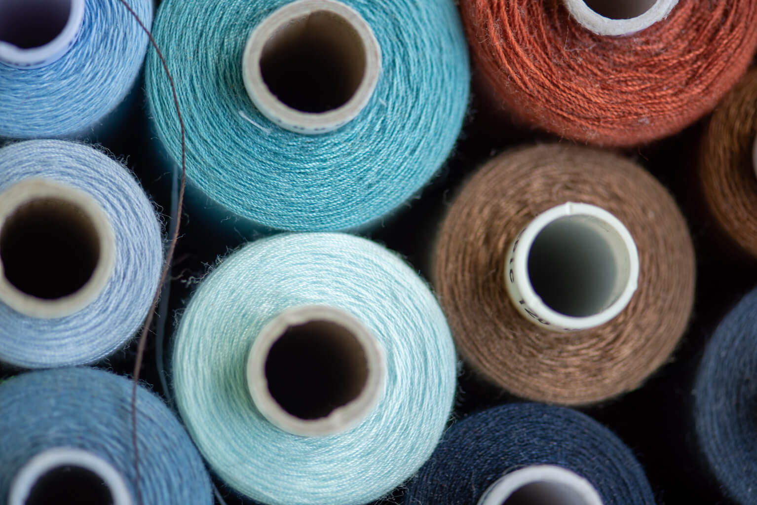 Wool Spools in blues and oranges