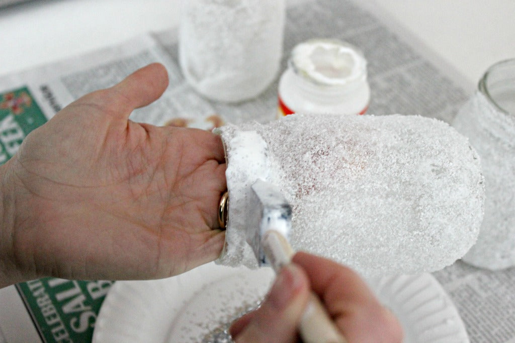 Apply Mod Podge to the edge of the Epsom salt luminaries