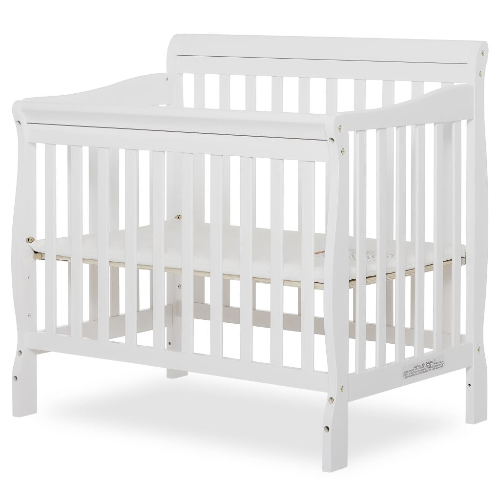 Photo 1 of Dream On Me Aden 4 in 1 Convertible Mini Crib, White------there is a deep scratch on one of the sides -------