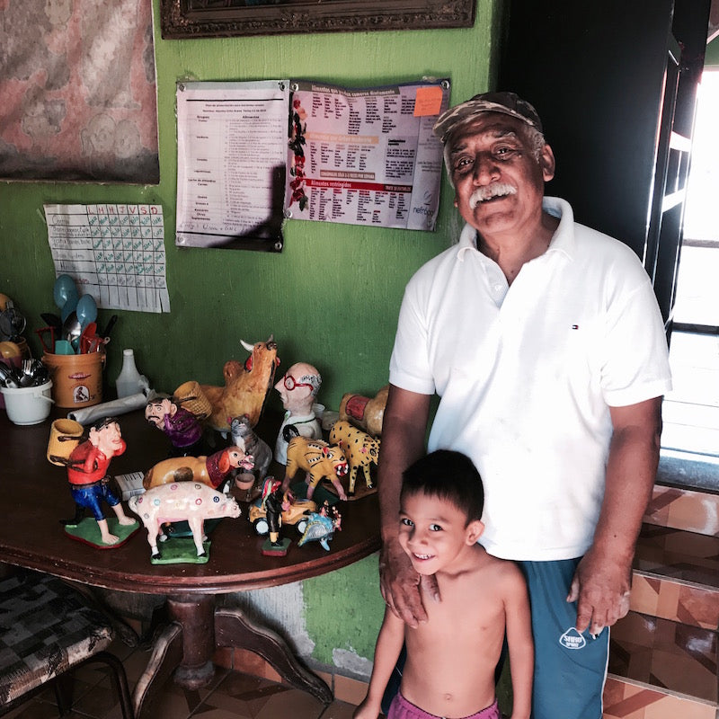 Mexican ceramic artist Juan Jose Ramos Medrano and son Abel in their home.