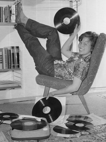 1950s teenager listening to records