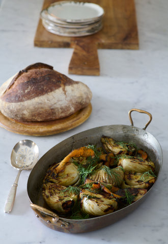 Stack of Bare Salad Plates with Bronze drip, Roasted Fennel and Homemade bread