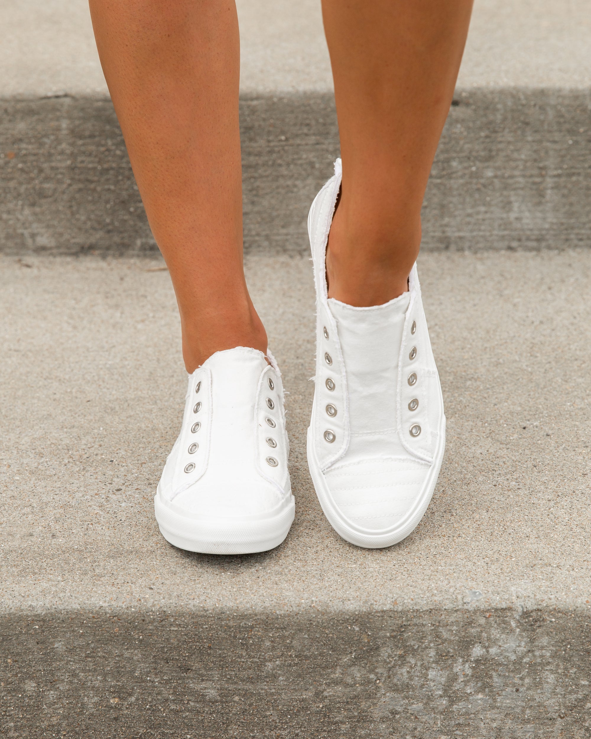 white slip on athletic shoes