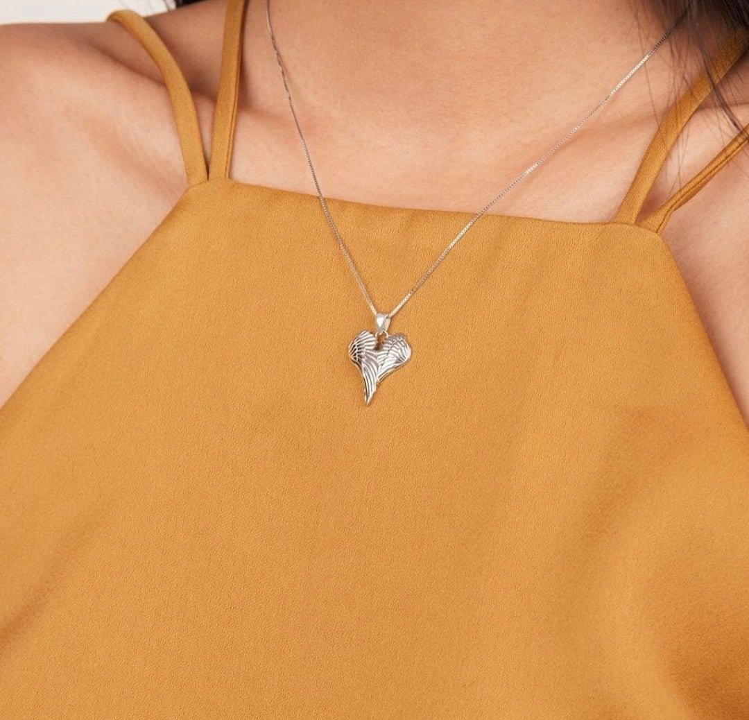 Angel wing necklace on a female