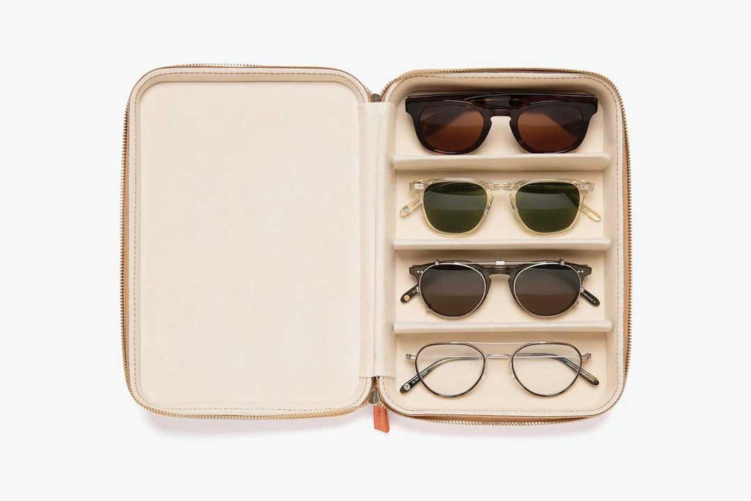 Aerial view of leather travel case containing 4 sunglasses frames