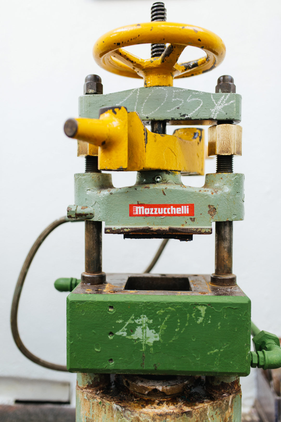 An acetate block casting press inside the Mazzucchelli factory Italy