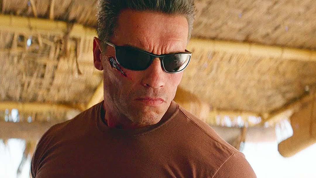 Arnold Schwarzenegger wearing dark black sunglasses inside beach café in Terminator Dark Fate movie