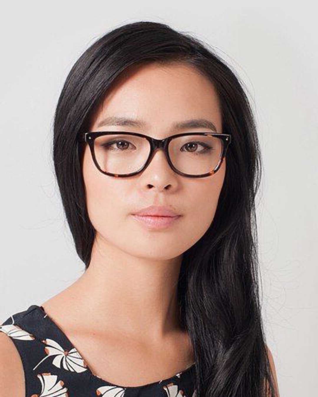 Asian lady wearing dark Wayfarer spectacle frame