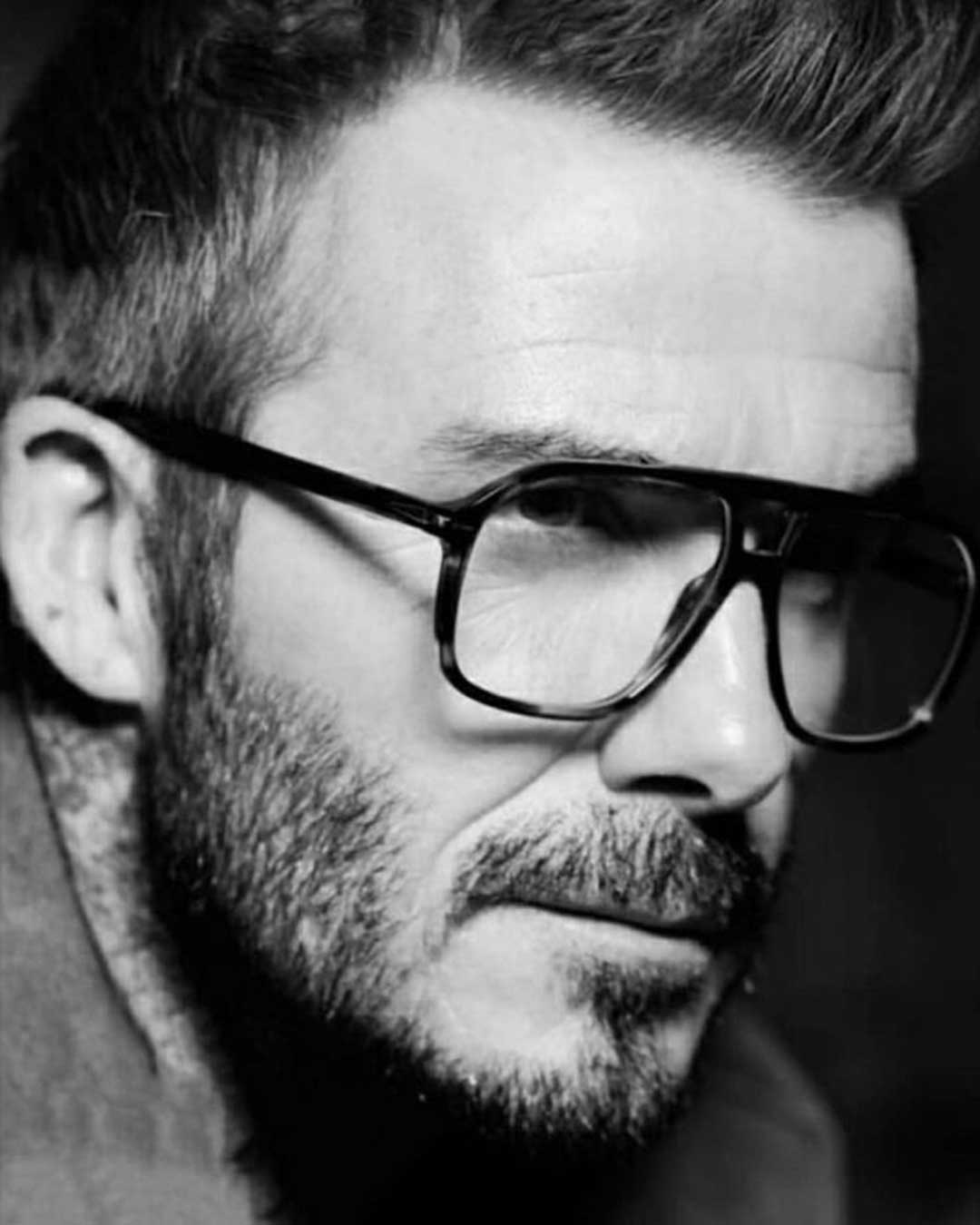 Close side view of David Beckham wearing thick Aviator spectacle frame