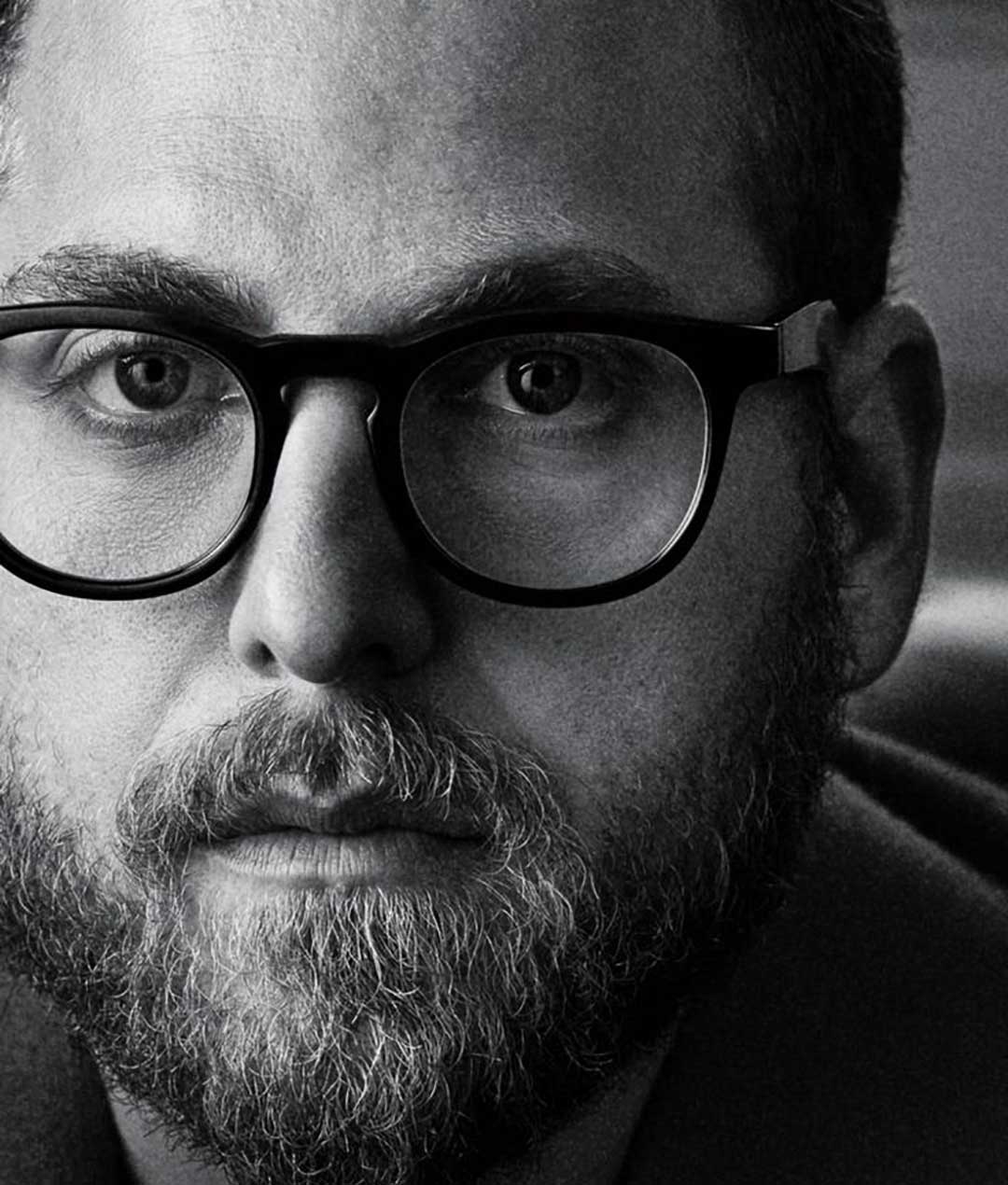 Close view of Jonah Hill wearing round black eyeglasses frame