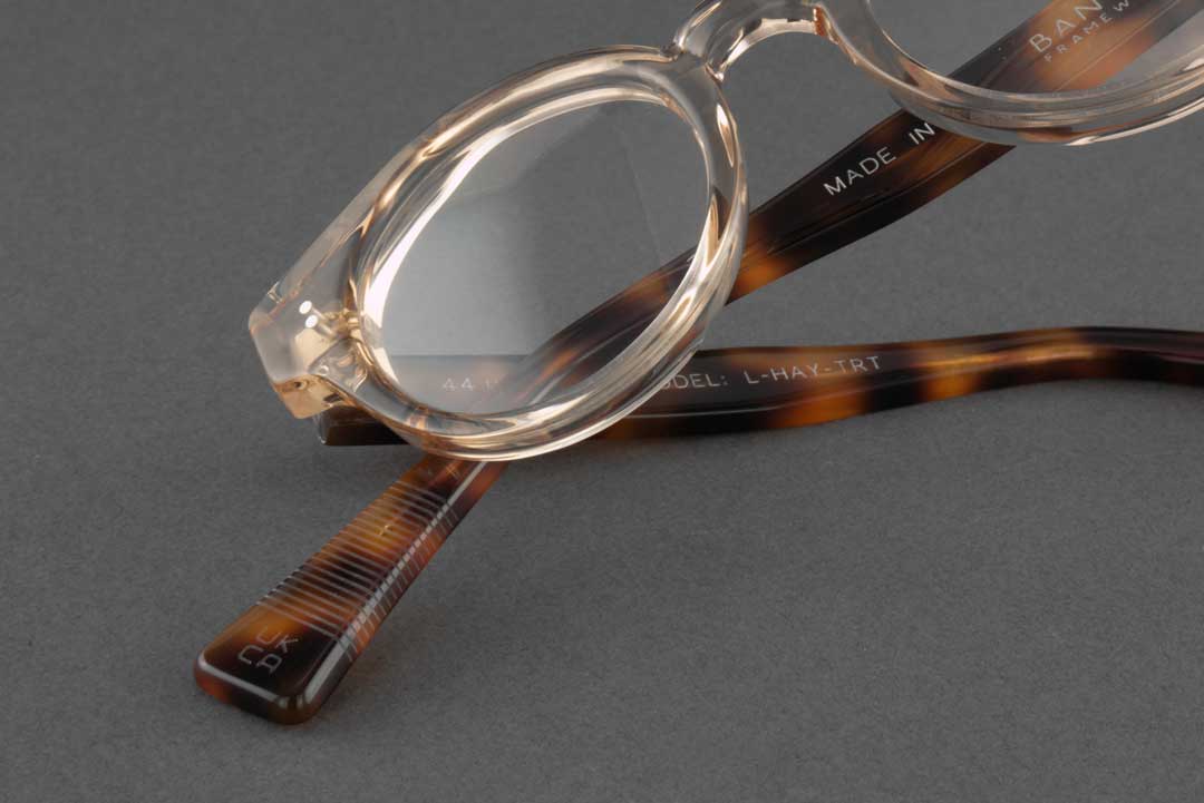 Close view of crooked tortoise glasses frame with thick lenses