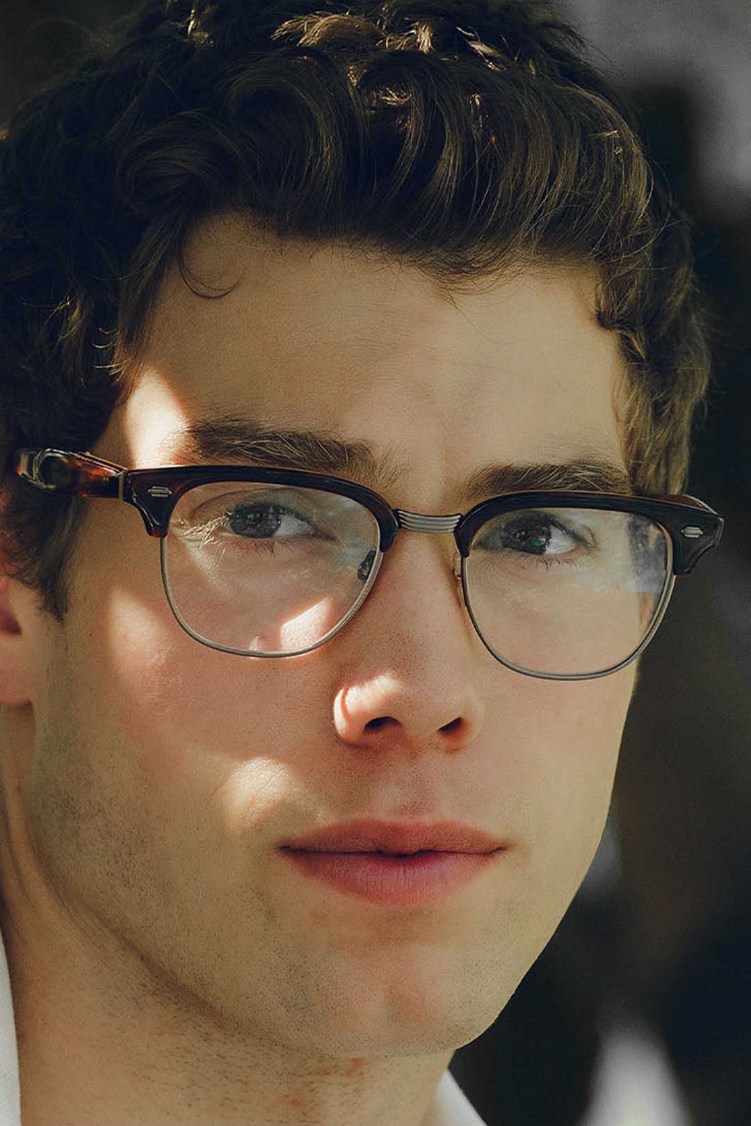 Close view of man wearing Clubmaster style eyeglasses frame
