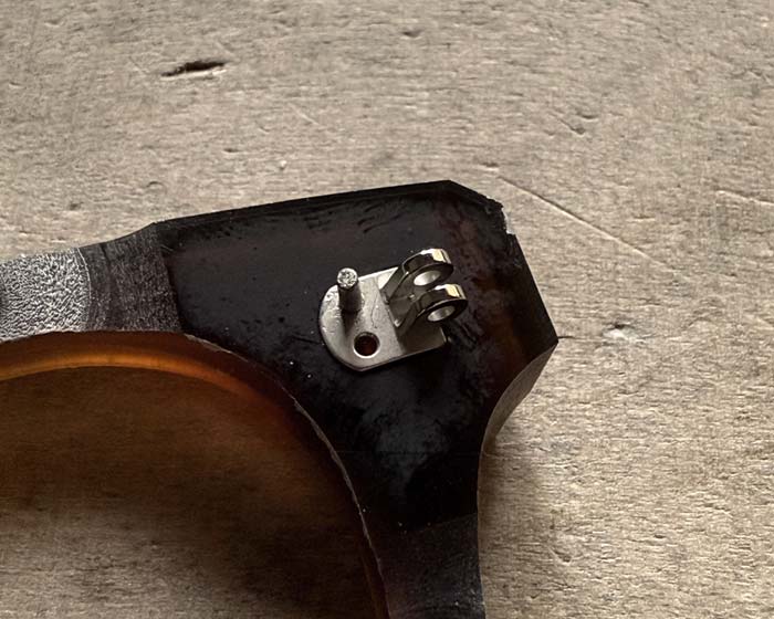 Close view of spectacle frame hinge