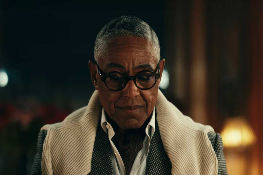 Front view of Stanley Johnston wearing round frame eyeglasses in the Netflix series The Gentleman