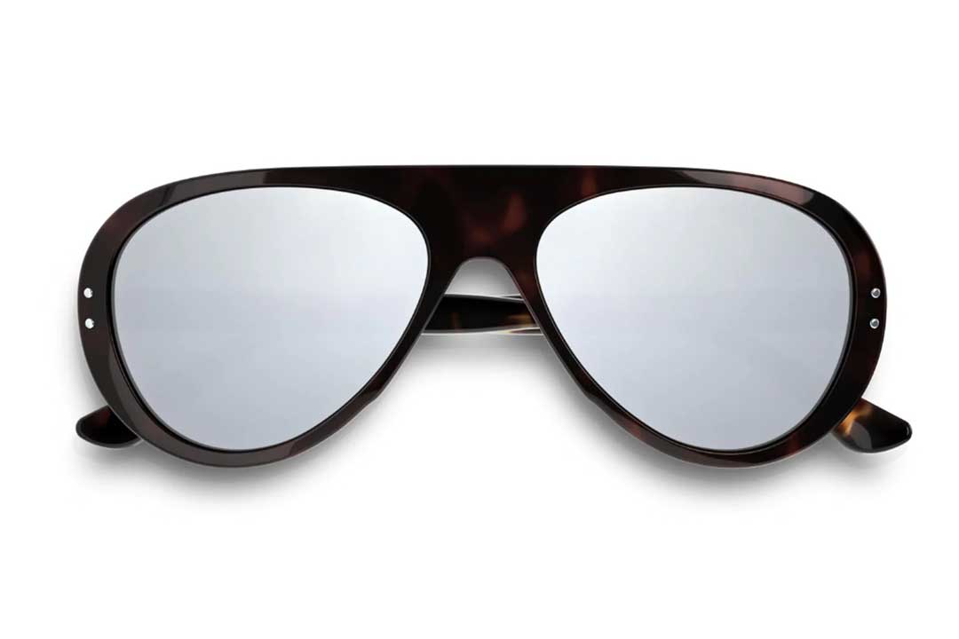 Front view of Vallon Ski Aviators sunglasses frame with silver mirror lenses lying folded on white background
