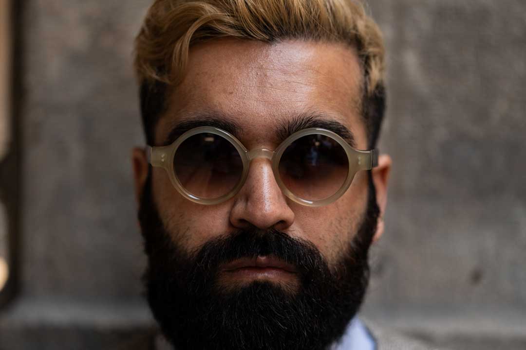 Front view of bearded man wearing round sunglasses frame