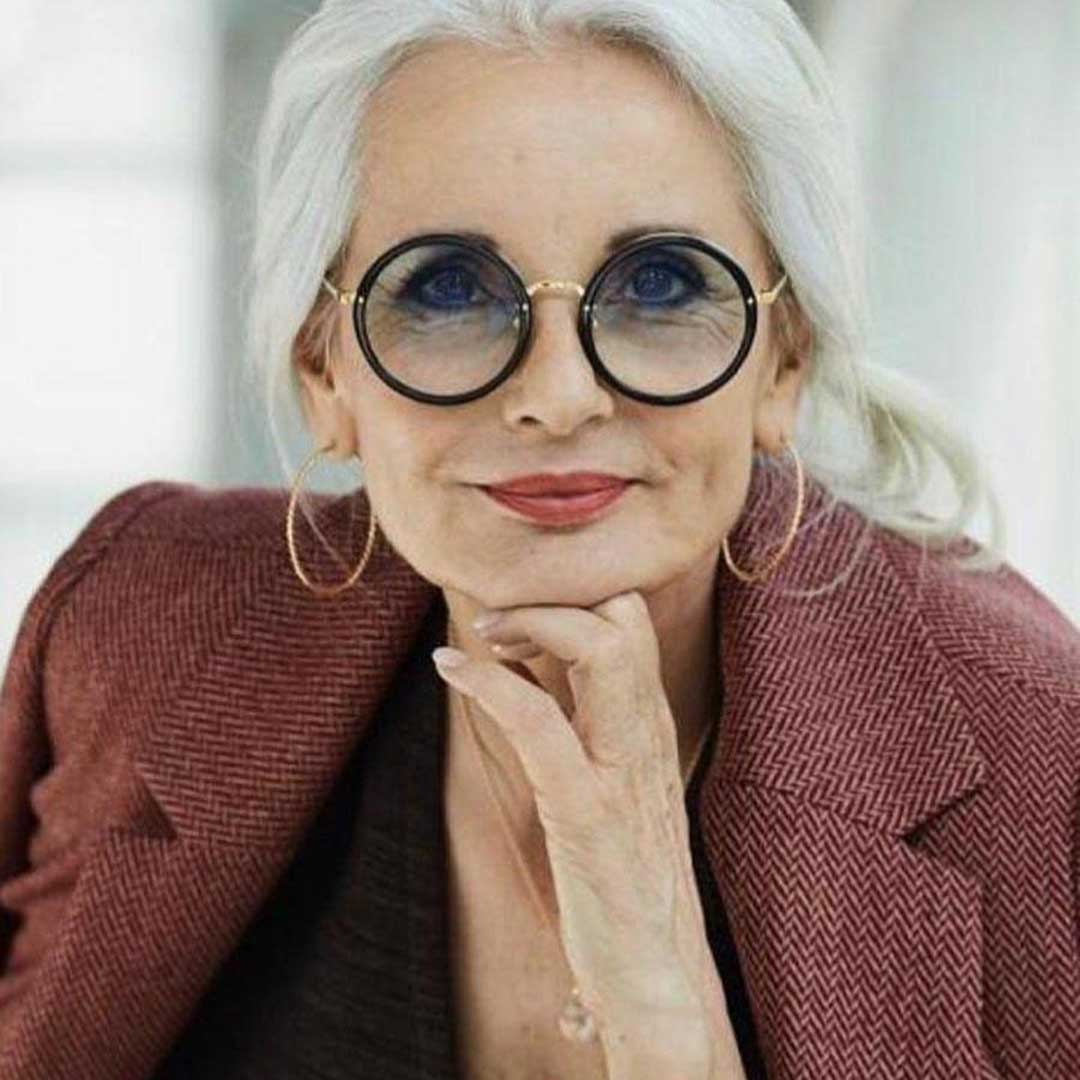 Grey haired lady with round eyeglasses frame