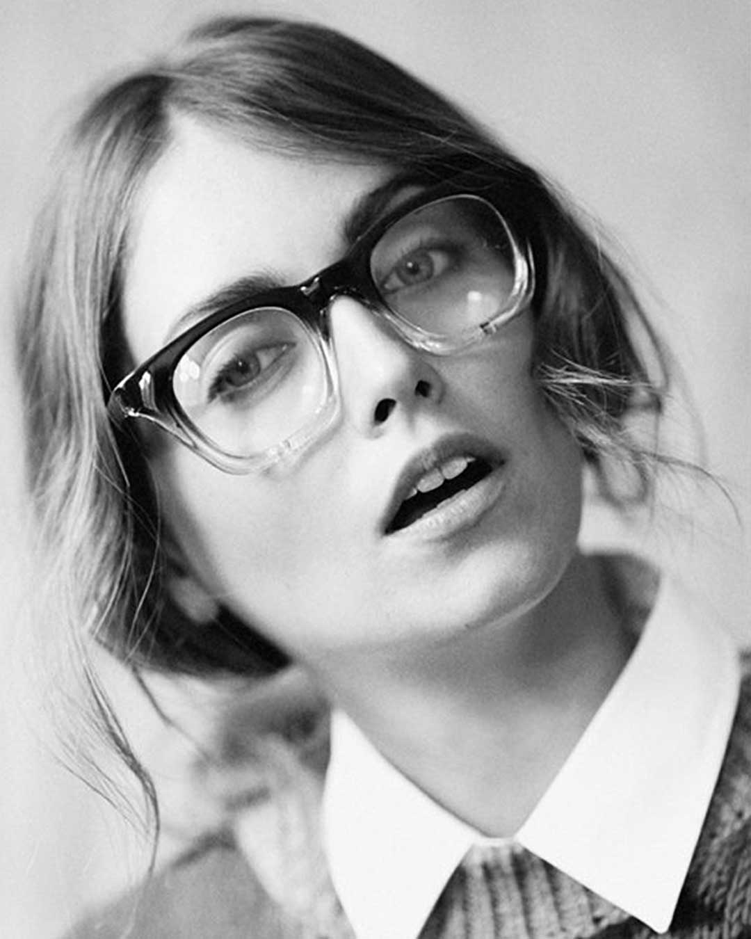 Greyscale portrait of woman wearing gradient two tone eyeglasses frame