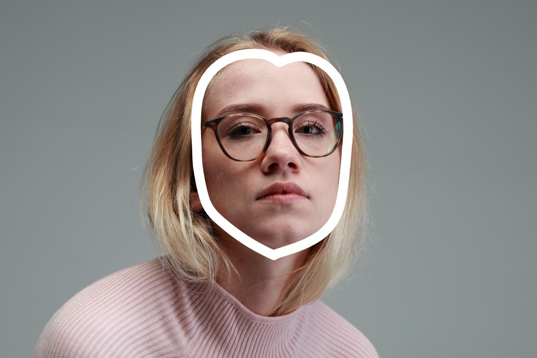 Heart shaped outline drawn over blonde woman wearing tortoise eyeglasses