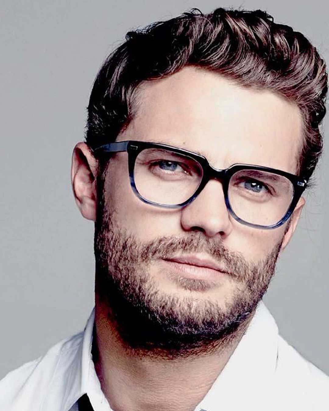 Man with beard wearing rectangular gradient eyeglasses frame and white shirt