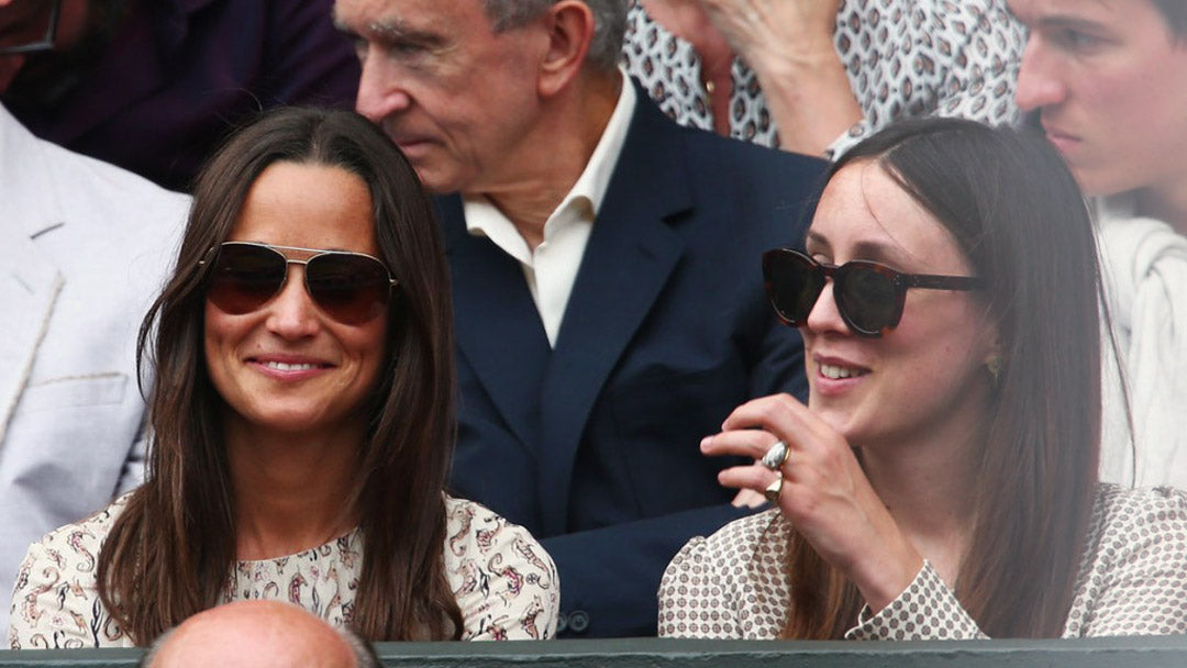 Pippa Middleton enjoying the tennis at Wimbledon smiling directly at viewer