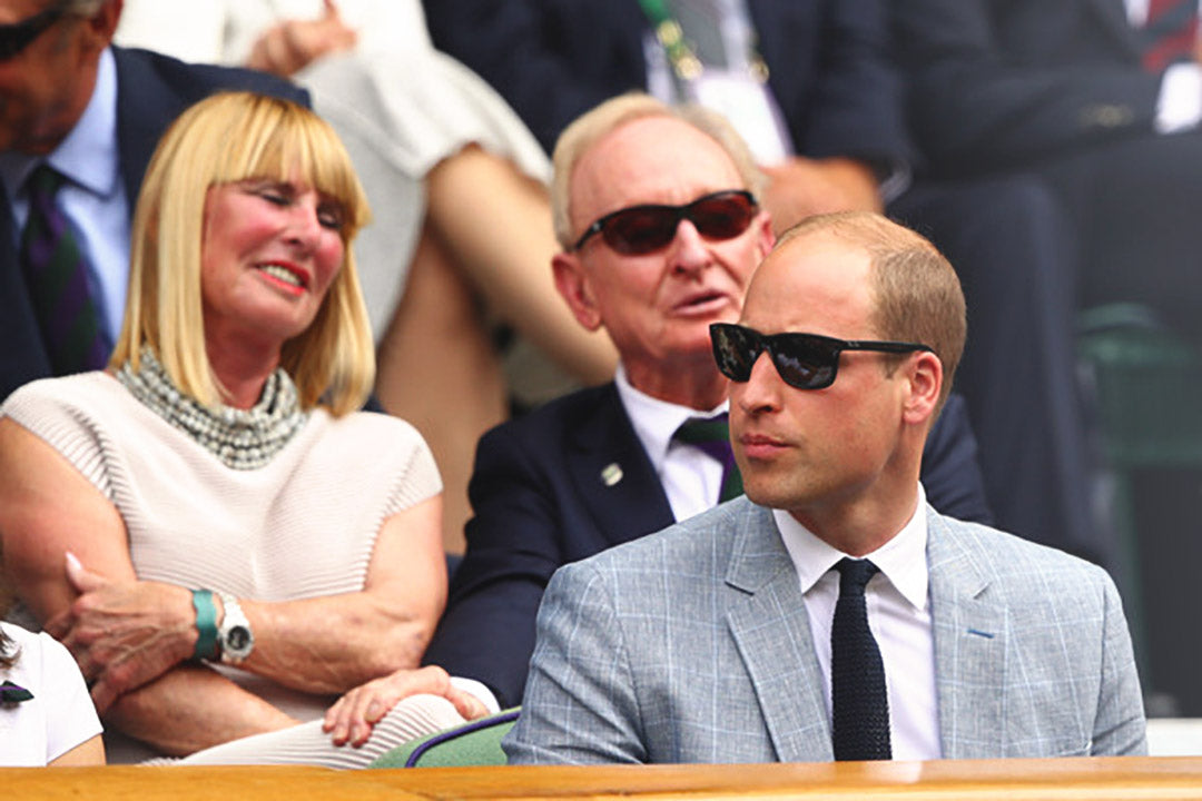 Prince William in the Royal Box at Wimbledon wearing suit and sunglasses