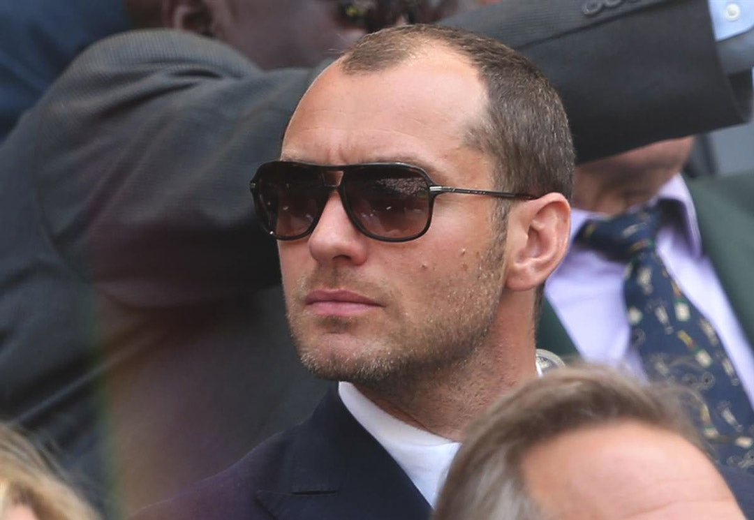 Side view of Jude Law amongst the crowd at SW19 Wimbledon tennis stadium